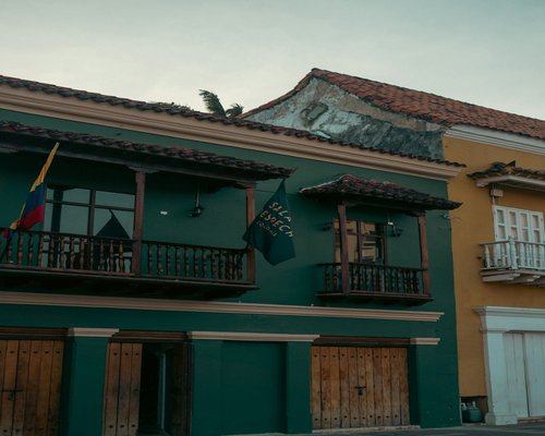 Person taking a break from laptop on a balcony in a Colombian city